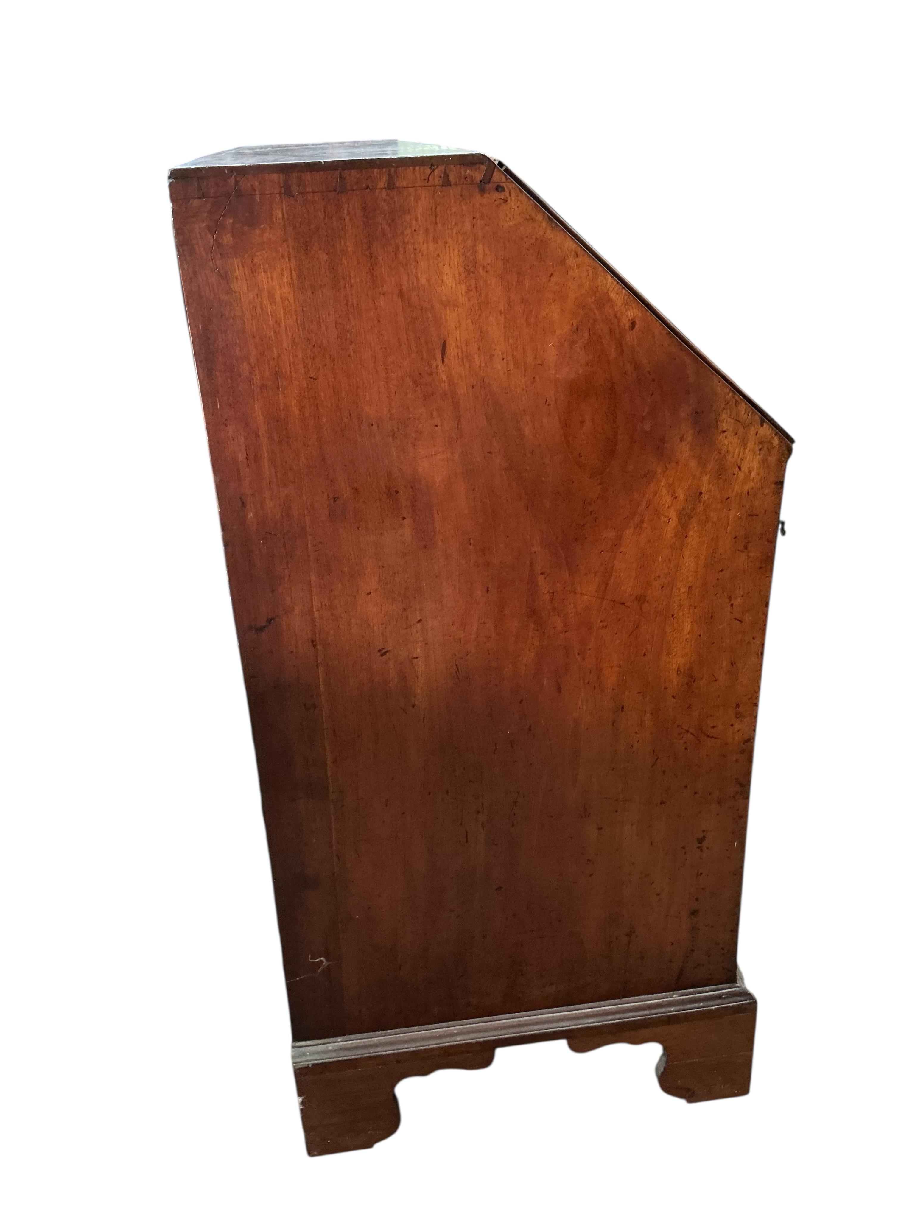 A George III mahogany bureau, with four long drawers on bracket feet, width 91cm, depth 53cm, height 108cm